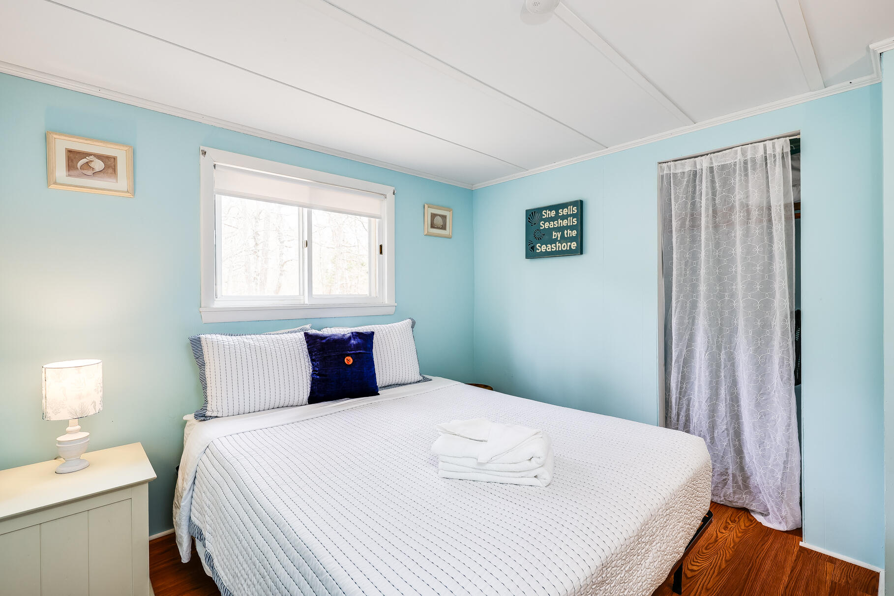 85 Boreen Road Eastham, MA 02642 - Photo 37 of 73 a bedroom with a bed and wooden floor