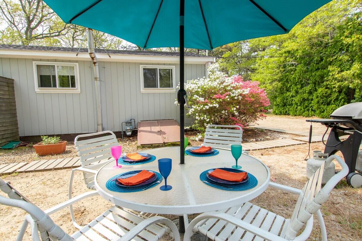 85 Boreen Road Eastham, MA 02642 - Photo 40 of 73 a table and chairs are sitting on the wooden floor