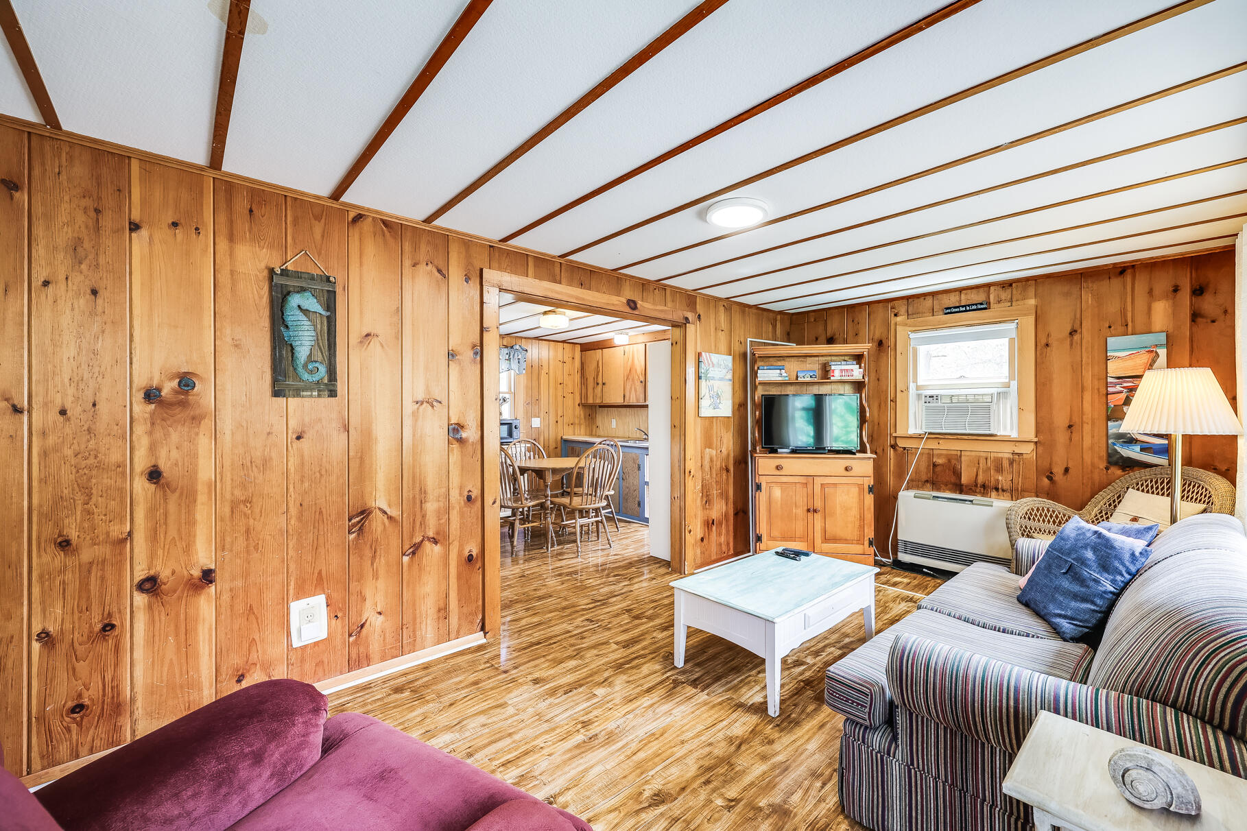 85 Boreen Road Eastham, MA 02642 - Photo 46 of 73 a living room with furniture a wooden floor and next to a window