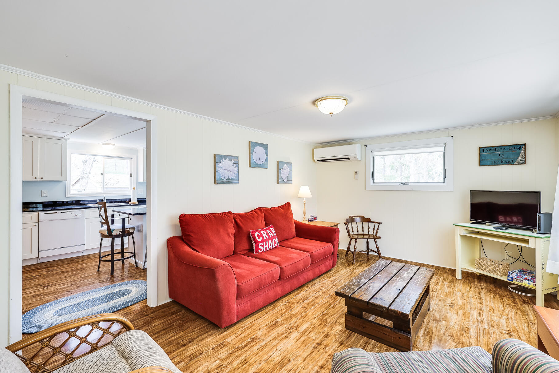85 Boreen Road Eastham, MA 02642 - Photo 7 of 73 a living room with furniture and a fireplace