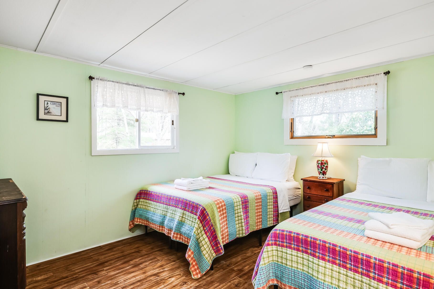 85 Boreen Road Eastham, MA 02642 - Photo 10 of 73 a bedroom with two beds and wooden floor