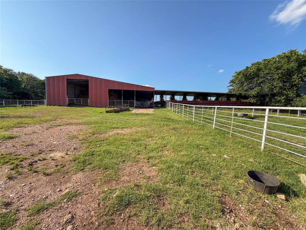 449 Private Road 4670 Rhome, TX 76078 - Photo 32 of 39 a view of a house with a big yard
