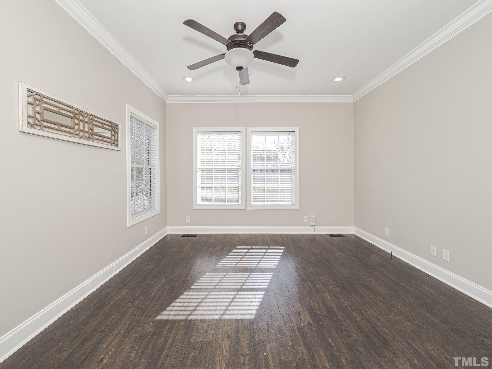 1213 Silver Farm Road Raleigh, NC 27603 - Photo 17 of 27 wooden floor in an empty room with a window