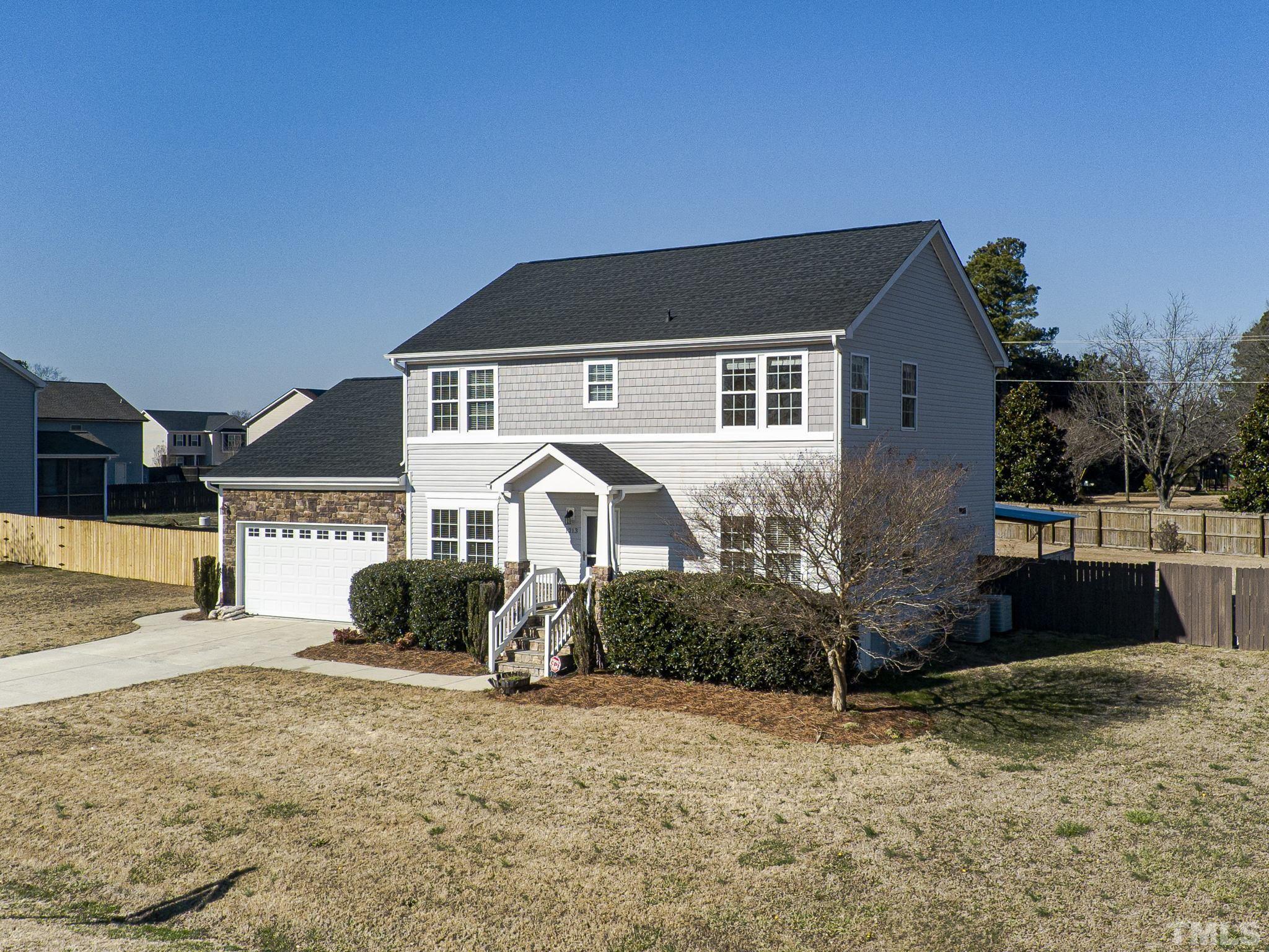 1213 Silver Farm Road Raleigh, NC 27603 - Photo 3 of 27 a front view of a house with a yard