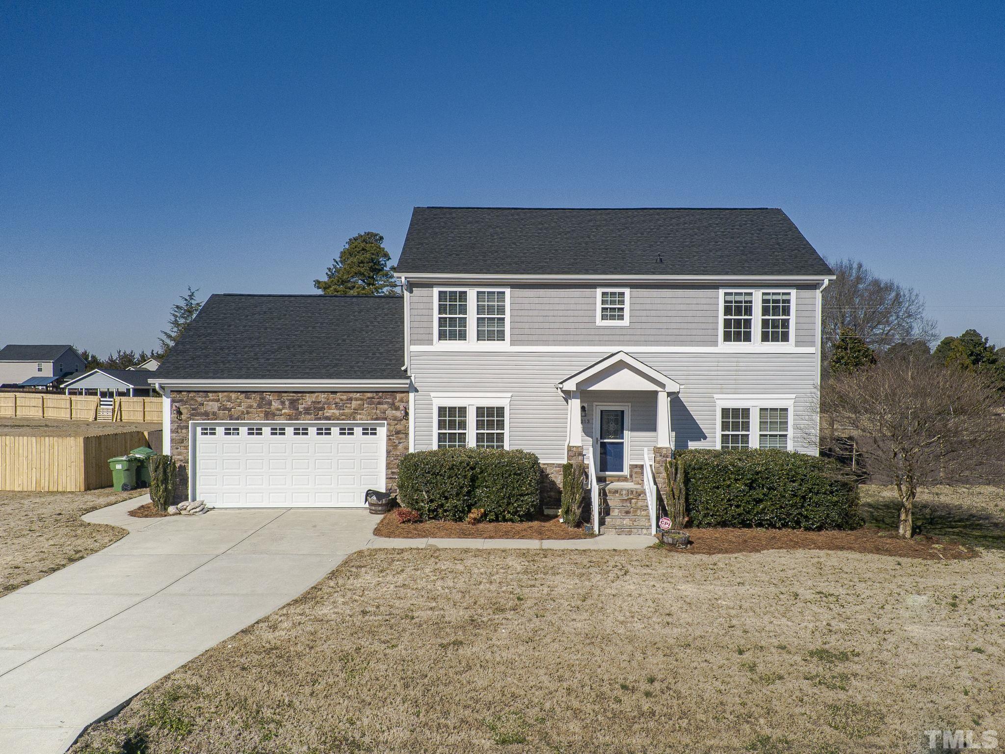 1213 Silver Farm Road Raleigh, NC 27603 - Photo 4 of 27 a front view of a house with a yard