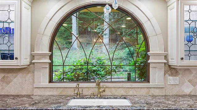 a dining room with furniture and window