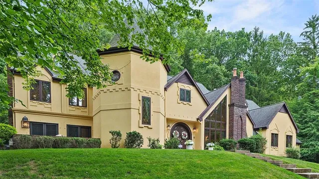 a dining room with a table and chairs
