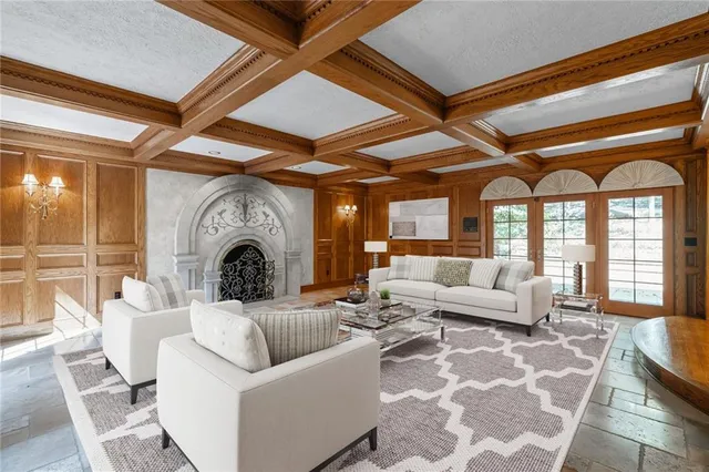 a kitchen with stainless steel appliances granite countertop sink stove and wooden cabinets