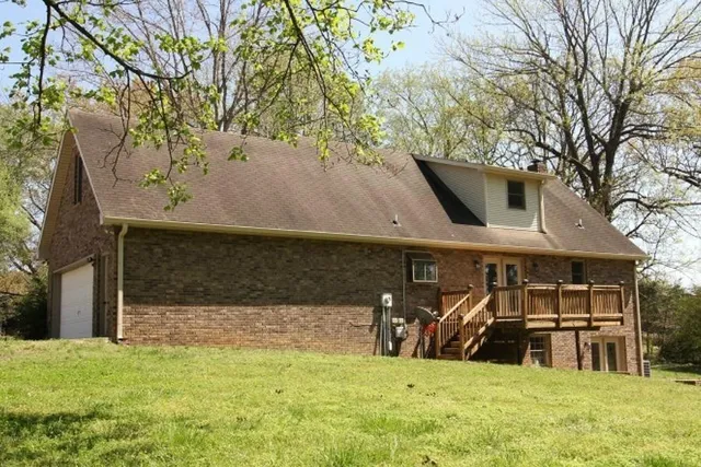 a view of a backyard of the house