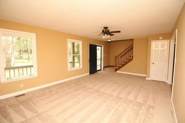 a view of an empty room with a window