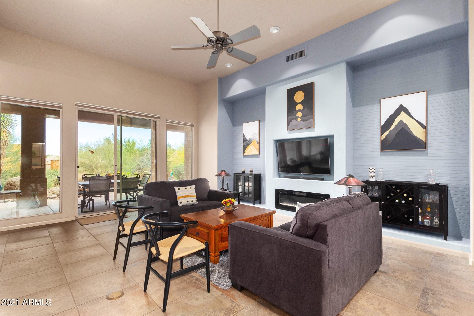 27929 North Quail Spring Road Rio Verde, AZ 85263 - Photo 5 of 37 TV wall with crystal fireplace