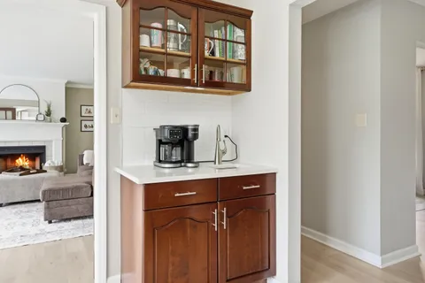 a kitchen with a stove and a fireplace
