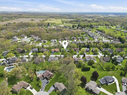 an aerial view of residential houses with outdoor space