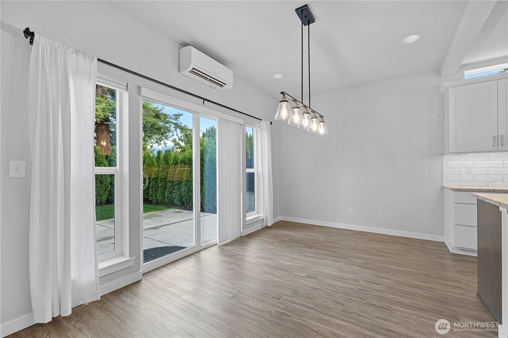 529 Ball Street, Unit A & B Sedro-Woolley, WA 98284 - Photo 13 of 31 a view of empty room with wooden floor and fan