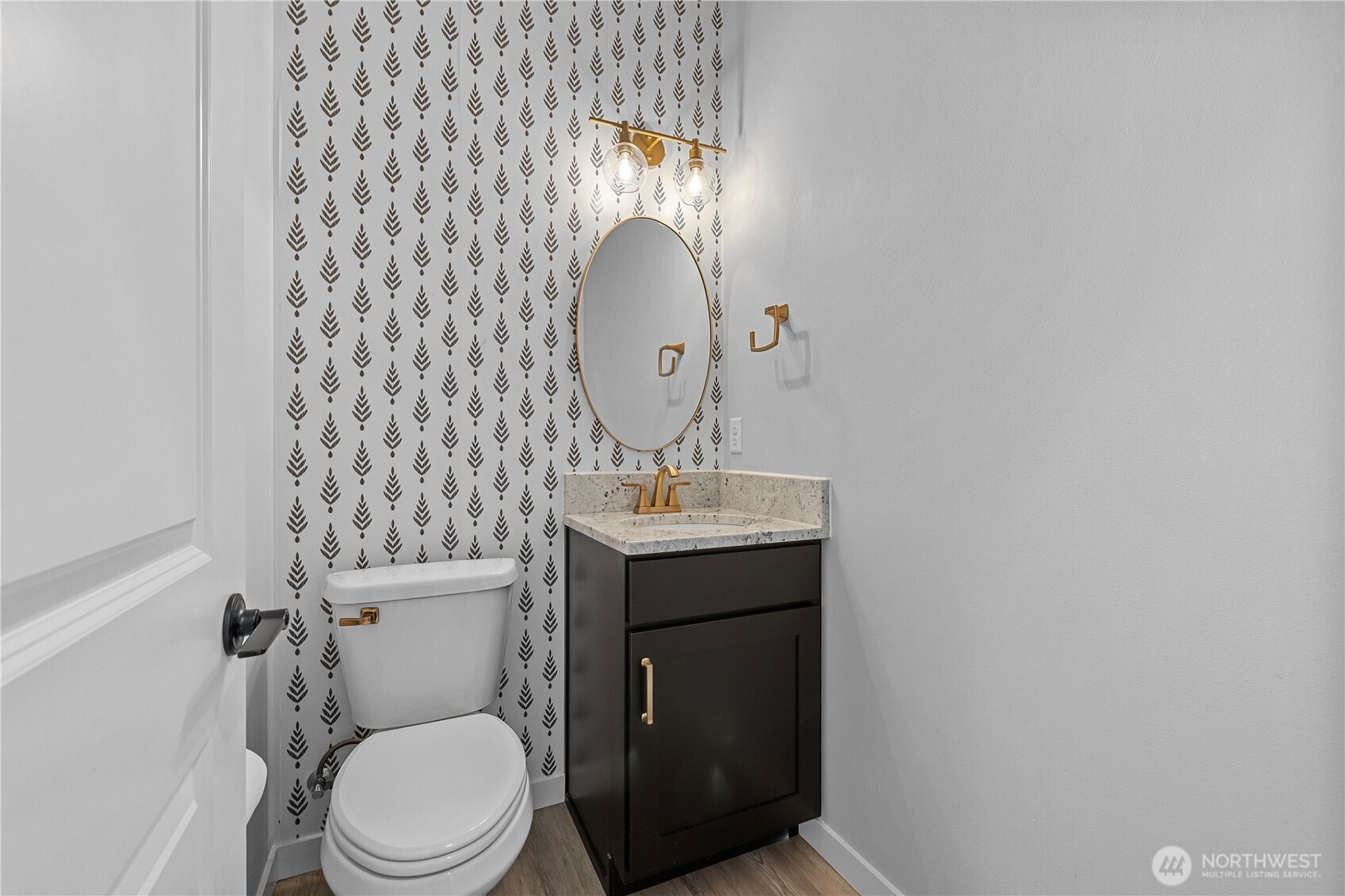 529 Ball Street, Unit A & B Sedro-Woolley, WA 98284 - Photo 14 of 31 a bathroom with a toilet a sink and mirror