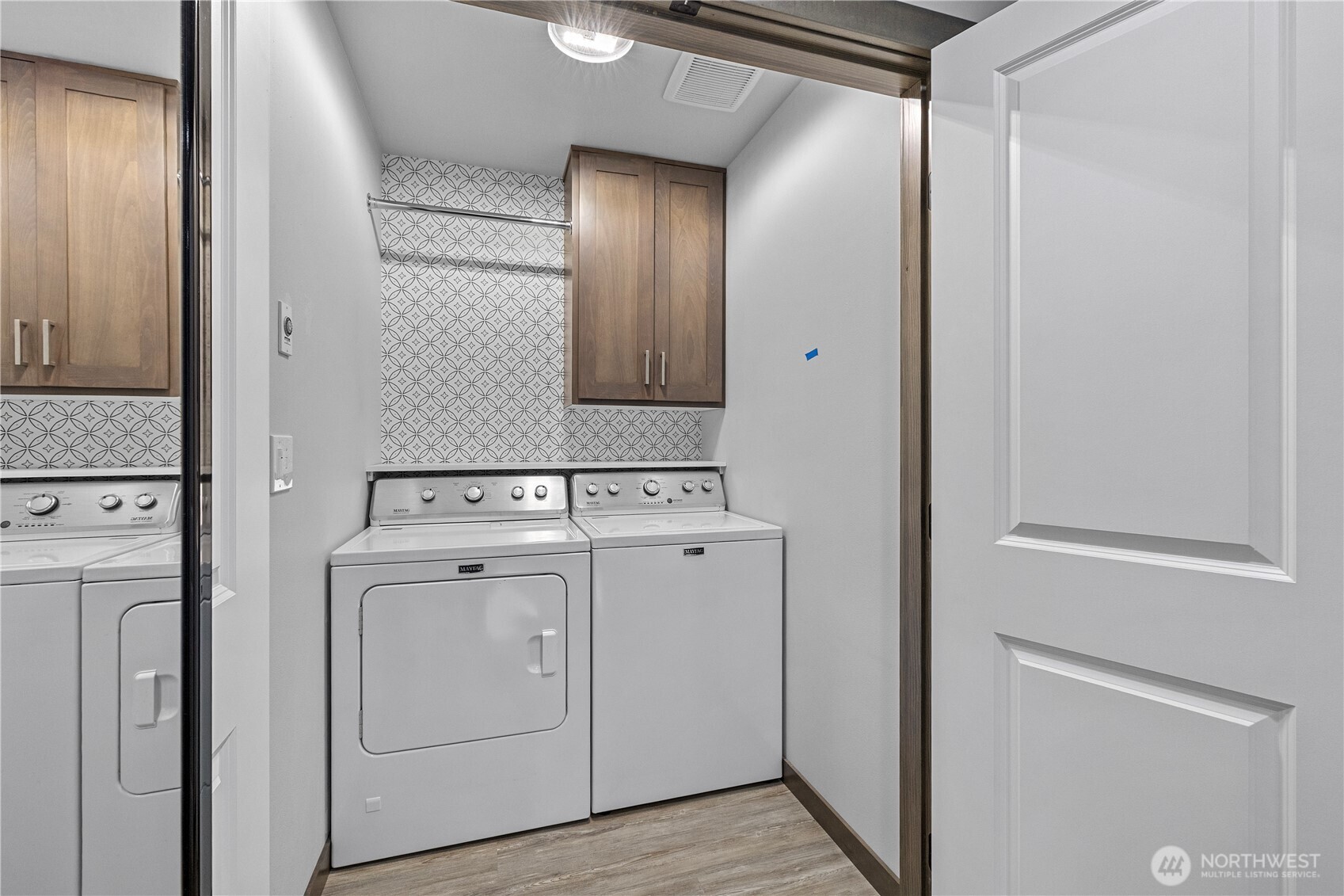 529 Ball Street, Unit A & B Sedro-Woolley, WA 98284 - Photo 16 of 31 a view of washer and dryer with wooden floor