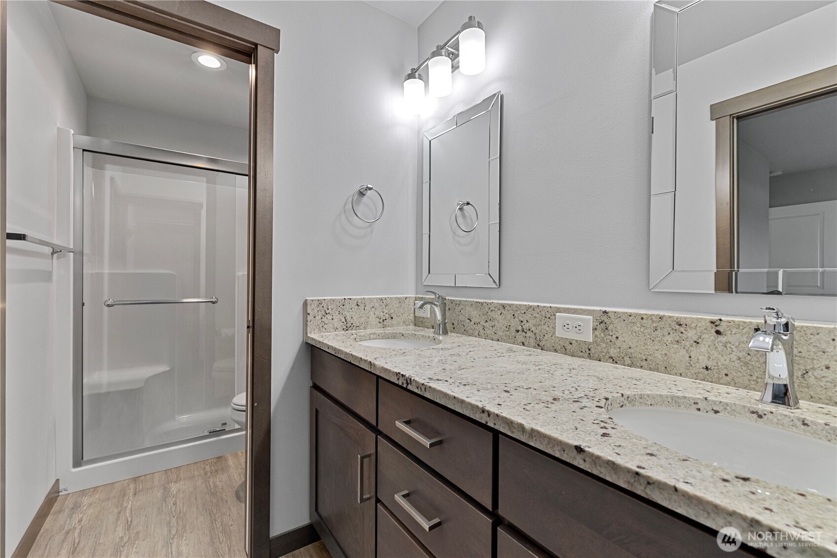529 Ball Street, Unit A & B Sedro-Woolley, WA 98284 - Photo 22 of 31 a bathroom with a granite countertop sink a toilet and shower