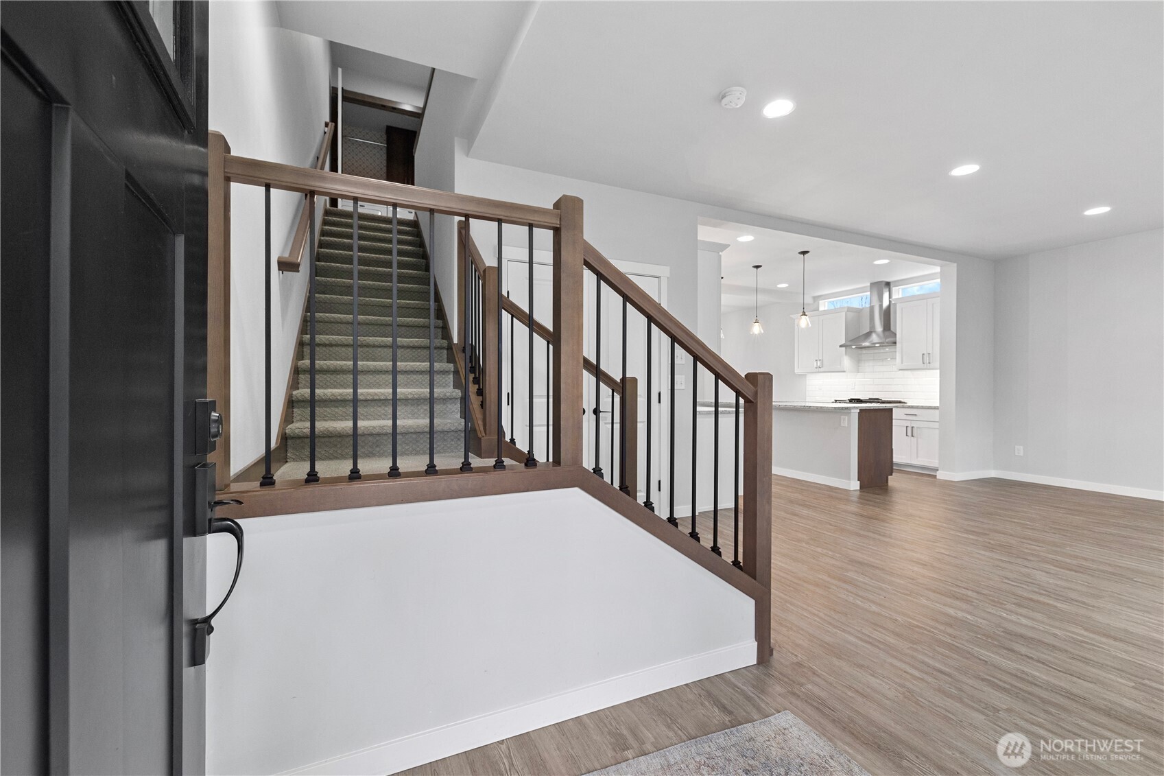 529 Ball Street, Unit A & B Sedro-Woolley, WA 98284 - Photo 4 of 31 a view of a hallway with wooden floor and staircase