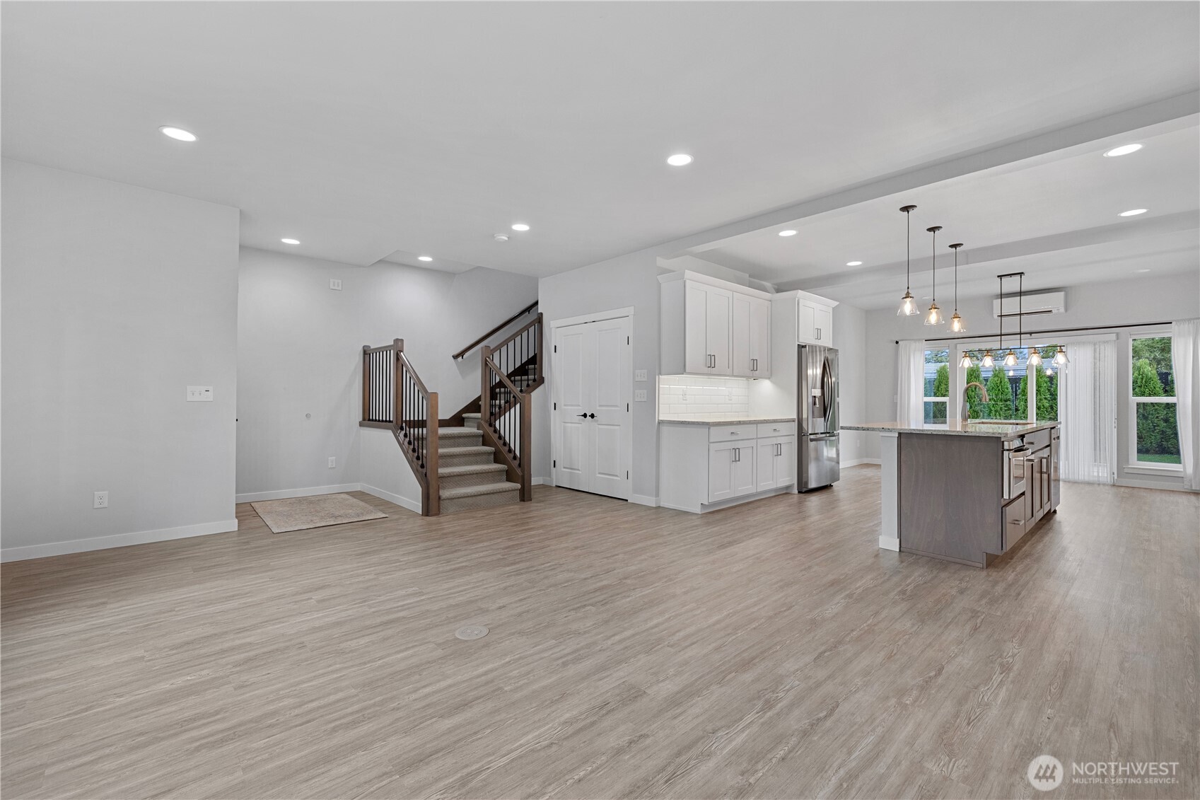 529 Ball Street, Unit A & B Sedro-Woolley, WA 98284 - Photo 7 of 31 a view of a big room with wooden floor and windows