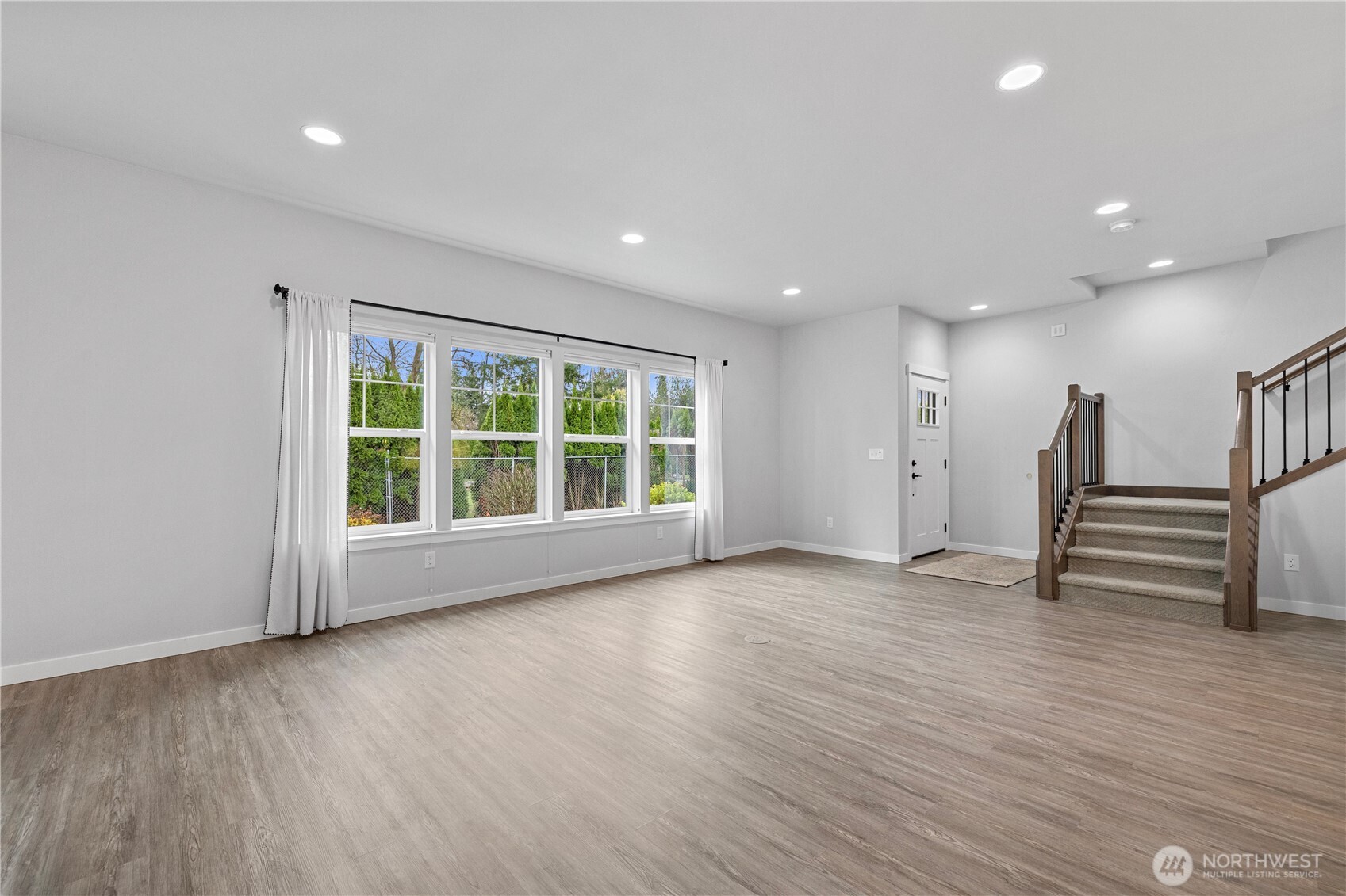 529 Ball Street, Unit A & B Sedro-Woolley, WA 98284 - Photo 8 of 31 a view of an empty room with wooden floor and a window
