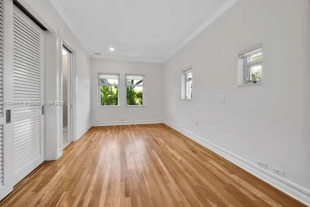 a view of a lake with couches in the patio