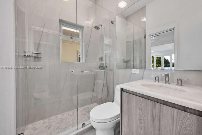 621 North Mashta Drive Key Biscayne, FL 33149 - Photo 23 of 34 a bathroom with a sink toilet and shower