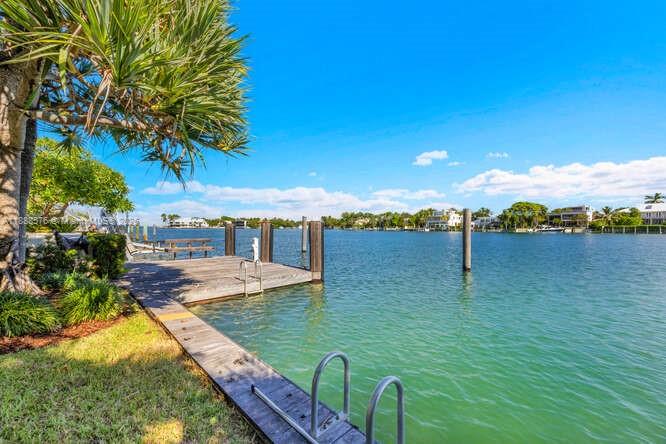 621 North Mashta Drive Key Biscayne, FL 33149 - Photo 31 of 34 a view of a lake with couches in the patio