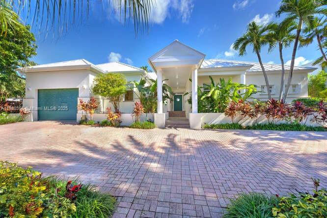 621 North Mashta Drive Key Biscayne, FL 33149 - Photo 4 of 34 a view of a backyard with potted plants