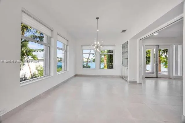 a view of an empty room and window