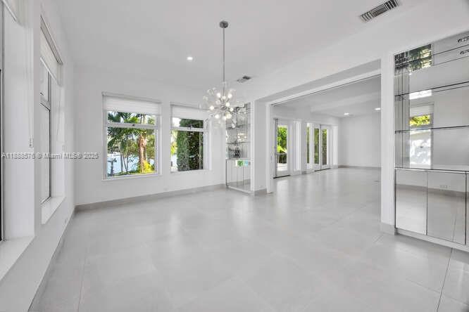 621 North Mashta Drive Key Biscayne, FL 33149 - Photo 9 of 34 a view of a big room with chandelier and windows