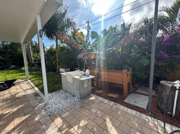 a view of a back yard from a patio