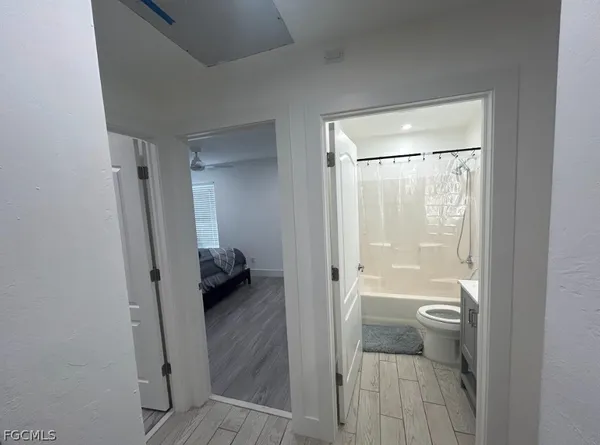 a bathroom with a glass door shower