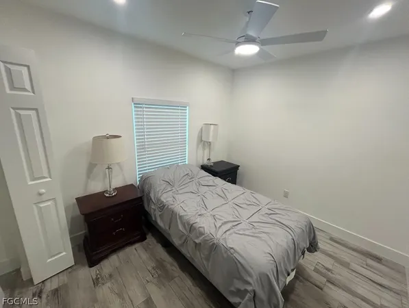 a bedroom with a bed and a closet