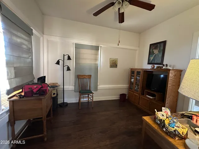 a livingroom with furniture and a flat screen tv