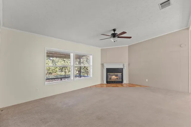 a kitchen with stainless steel appliances granite countertop a refrigerator a stove a sink and a microwave