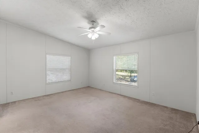 a bathroom with a tub a sink and a shower