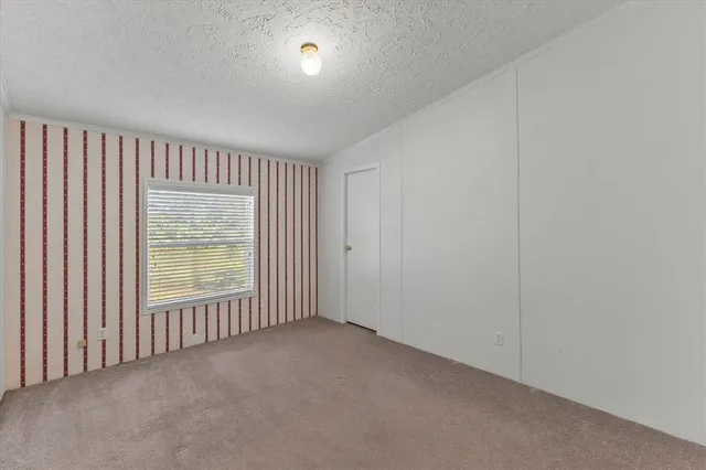 a bathroom with a granite countertop sink toilet a mirror and shower