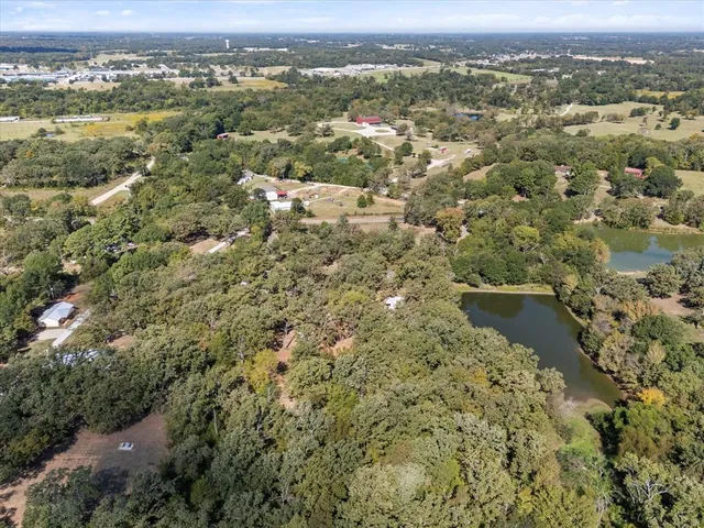 an aerial view of valley and lake