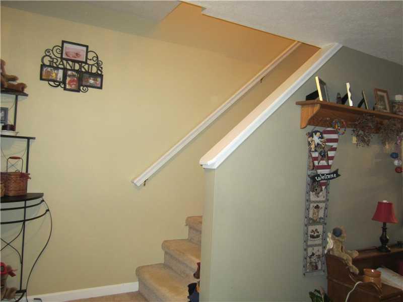 60 Walters Road Grove City, PA 16127 - Photo 14 of 25 Entry/Foyer. Front entry and steps to the upstairs.