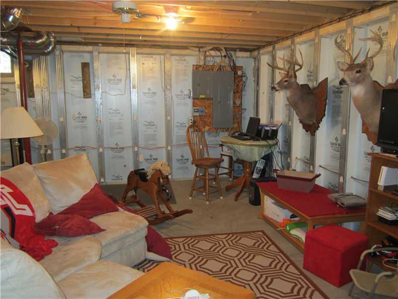 60 Walters Road Grove City, PA 16127 - Photo 17 of 25 Basement/Game Room. 2nd view of 24x23 basement room; electrical box on back wall.