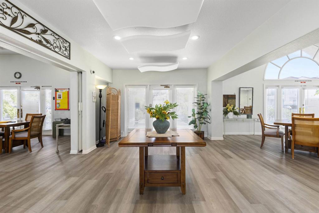 3305 Genoa Way, Unit 90 Oceanside, CA 92056 - Photo 27 of 35 a dining room with furniture and wooden floor
