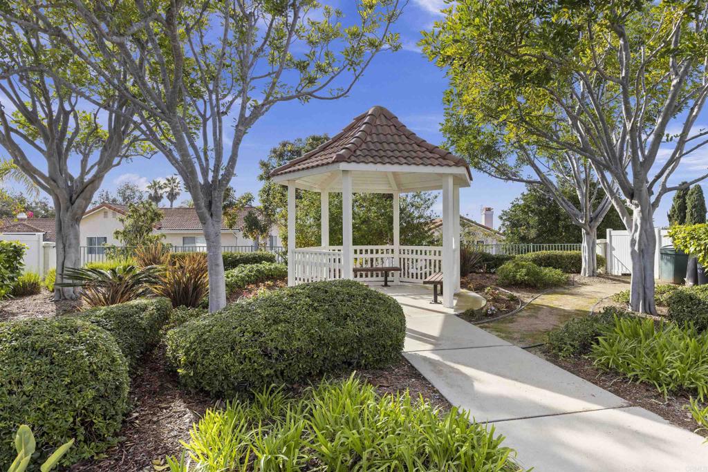 3305 Genoa Way, Unit 90 Oceanside, CA 92056 - Photo 30 of 35 a view of a garden with a fountain