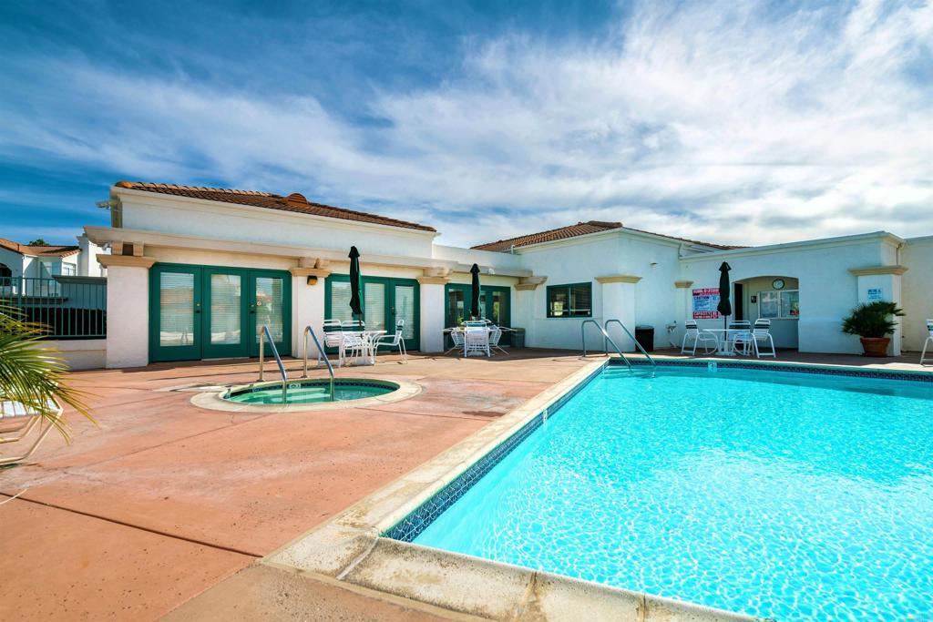 3305 Genoa Way, Unit 90 Oceanside, CA 92056 - Photo 33 of 35 a view of house with swimming pool outdoor seating area