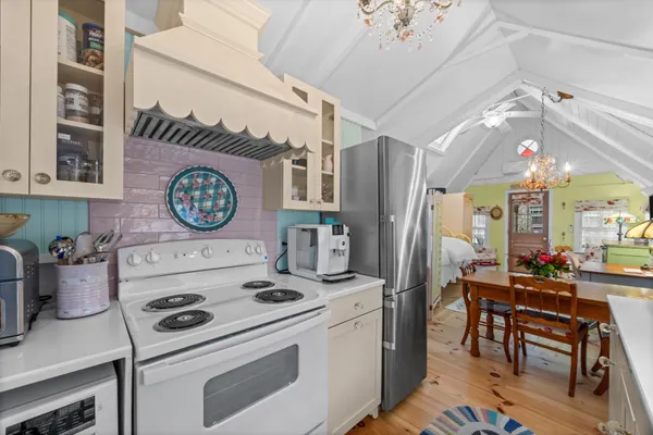 a kitchen with a stove and a refrigerator