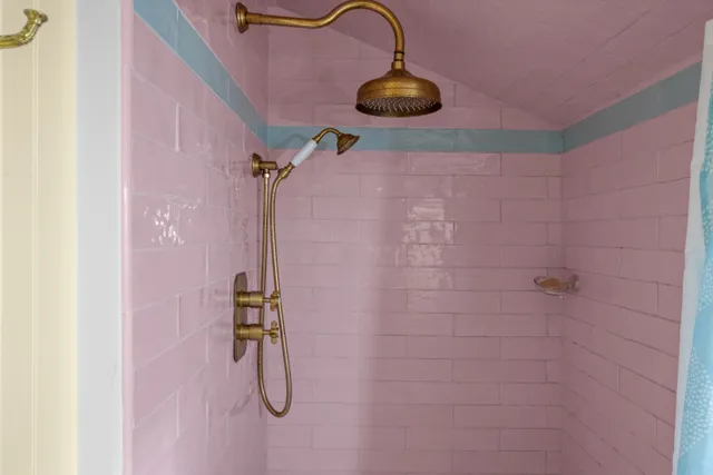 a patio with glass windows and yard