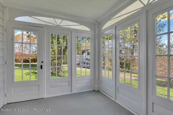 a kitchen with kitchen island granite countertop a sink cabinets and wooden floor