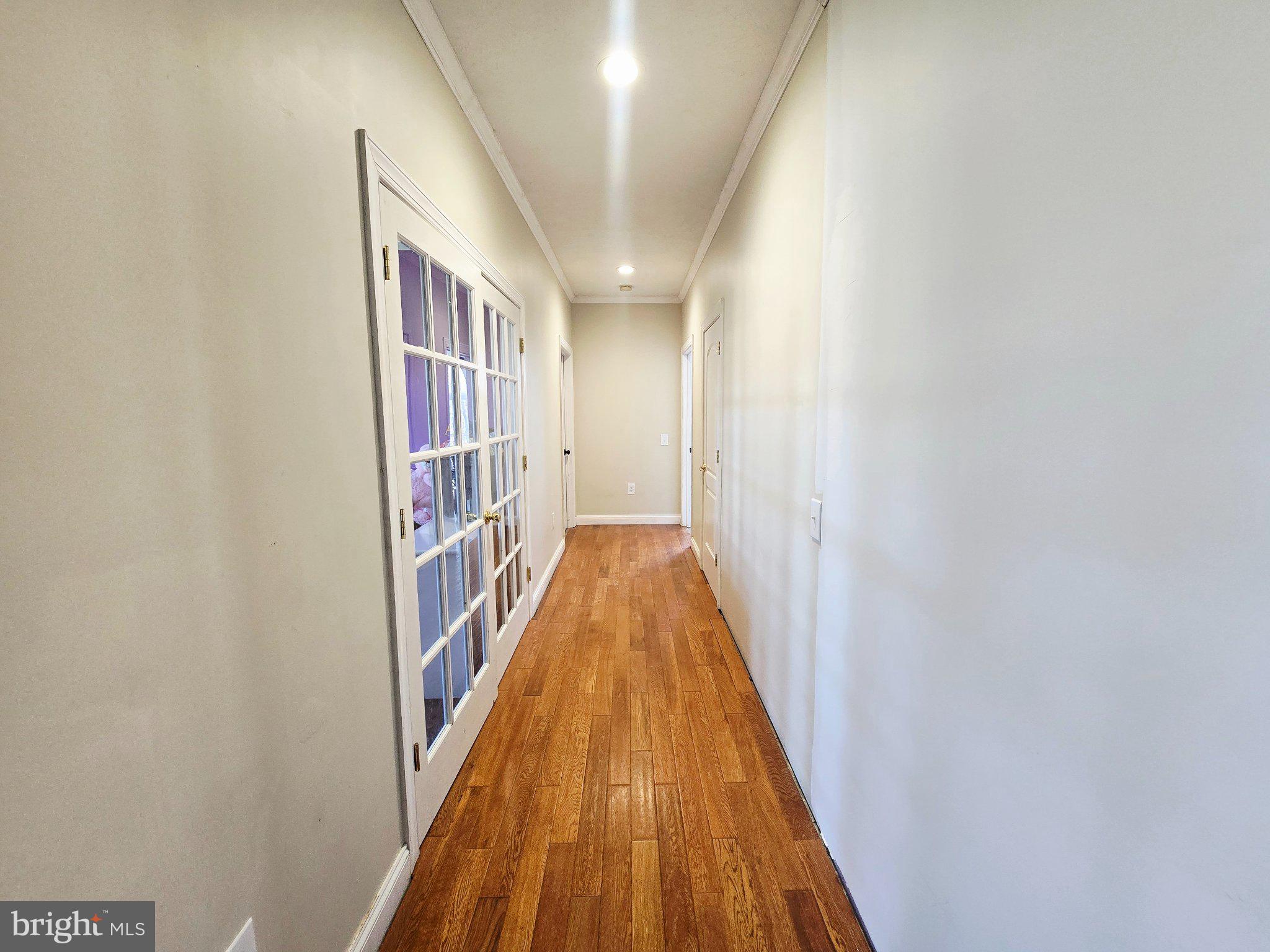 540 Plum Run Road Sugar Grove, WV 26815 - Photo 17 of 45 Inviting hallway with warm wood floors.