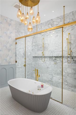 a bath tub sitting next to a white bath tub