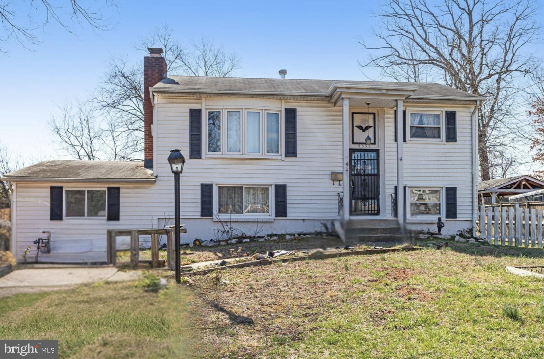 9535 Damascus Drive Manassas, VA 20109 - Photo 3 of 5 a front view of a house with a yard