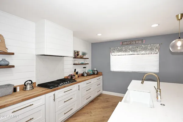 a kitchen with a sink and cabinets